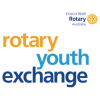 Men's White AS COLOUR Staple Tee with large Rotary Youth Exchange logo on front and D9640 icon on back Design